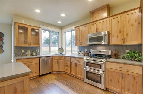 alder wood cabinets with black stainless steel appliances|alder kitchen cabinets picture gallery.